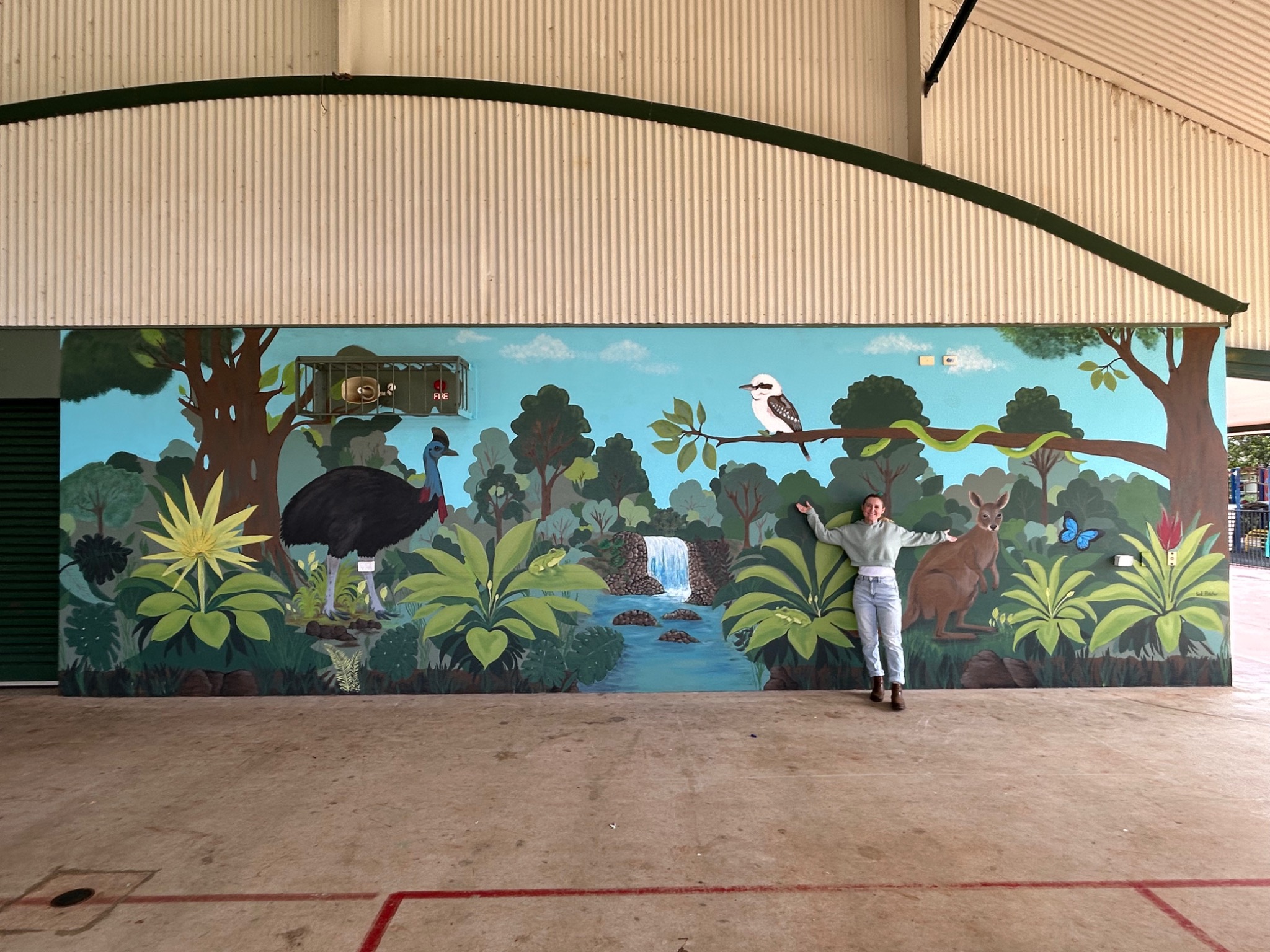 Tink working on a mural